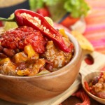 Chili Corn Carne - traditional mexican food, in wooden bowl,